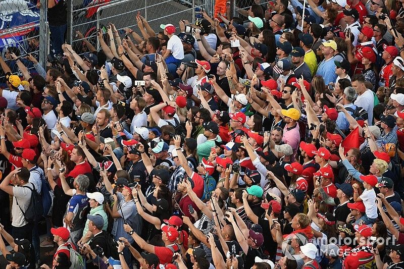 Fans cheer for the drivers on the podium