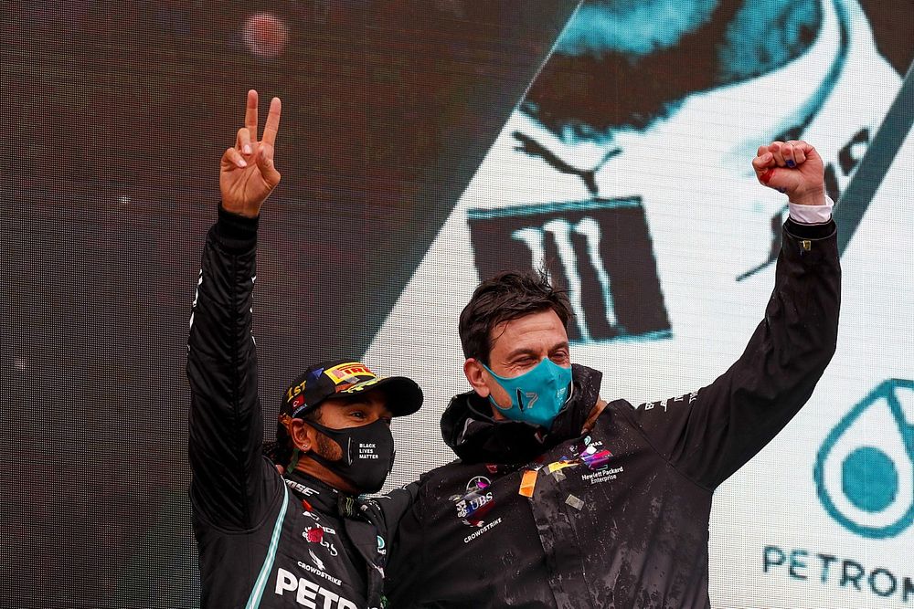 Lewis Hamilton, Mercedes-AMG F1, 1st position, and Toto Wolff, Executive Director (Business), Mercedes AMG, celebrate on the podium after securing a seventh world drivers title, on the podium