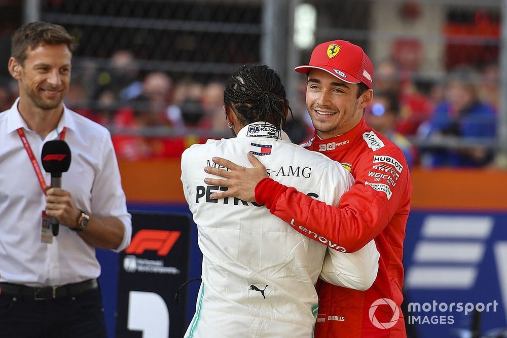 Pole winner Charles Leclerc, Ferrari, is congratulated by Lewis Hamilton, Mercedes AMG F1. Jenson Button 