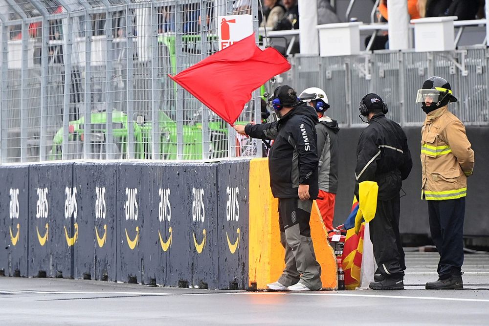 Marshals wave the red flag