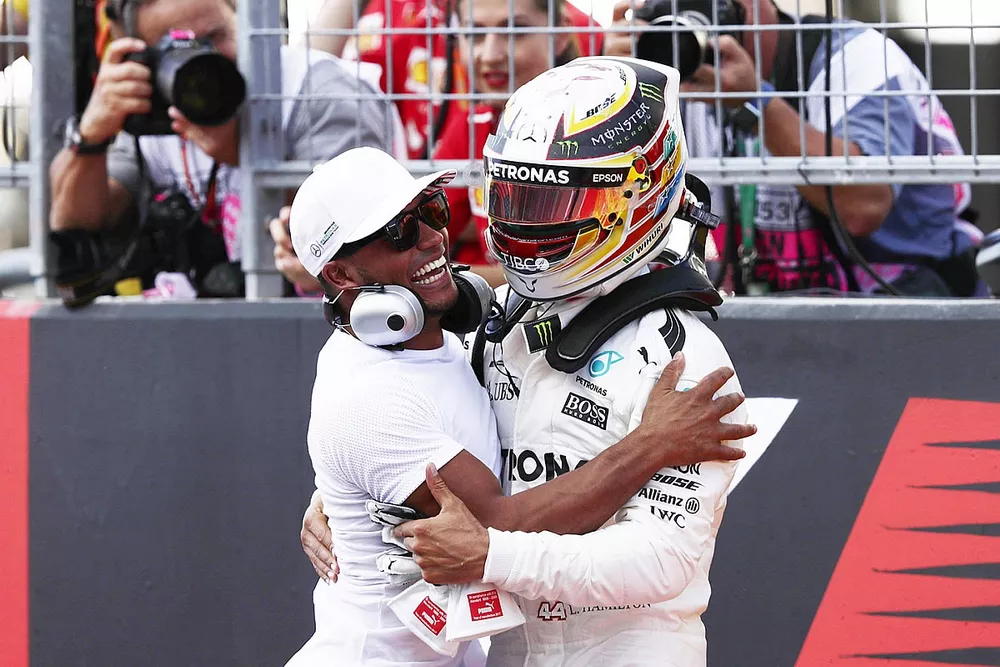Polesitter Lewis Hamilton, Mercedes AMG F1, celebrates with brother Nicolas Hamilton