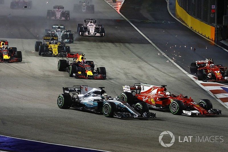 Sebastian Vettel, Ferrari SF70H, Max Verstappen, Red Bull Racing RB13, Kimi Raikkonen, Ferrari SF70H, collide at the start as Lewis Hamilton, Mercedes AMG F1 W08, finds his way through