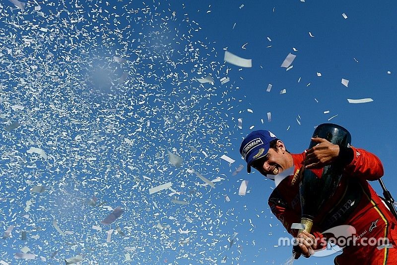 Lucas di Grassi, ABT Schaeffler Audi Sport, sprays the champagne on the podium