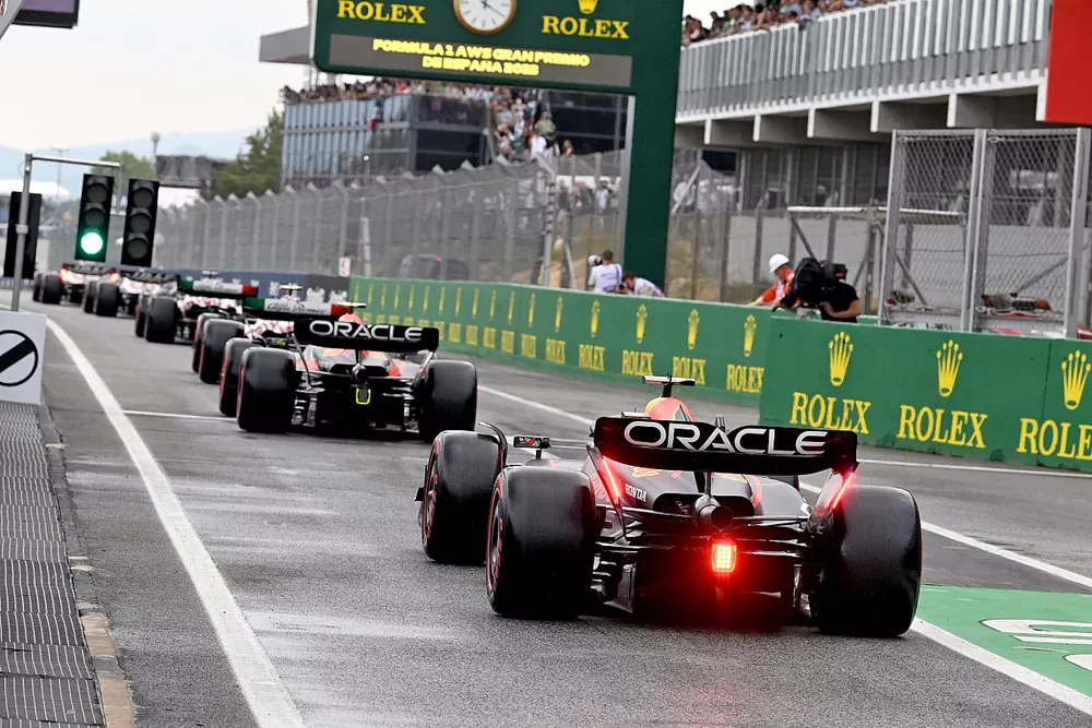 Sergio Perez, Red Bull Racing RB19, Max Verstappen, Red Bull Racing RB19, out of the pits