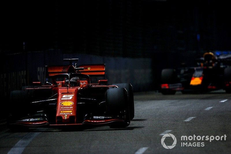 Sebastian Vettel, Ferrari SF90, leads Max Verstappen, Red Bull Racing RB15