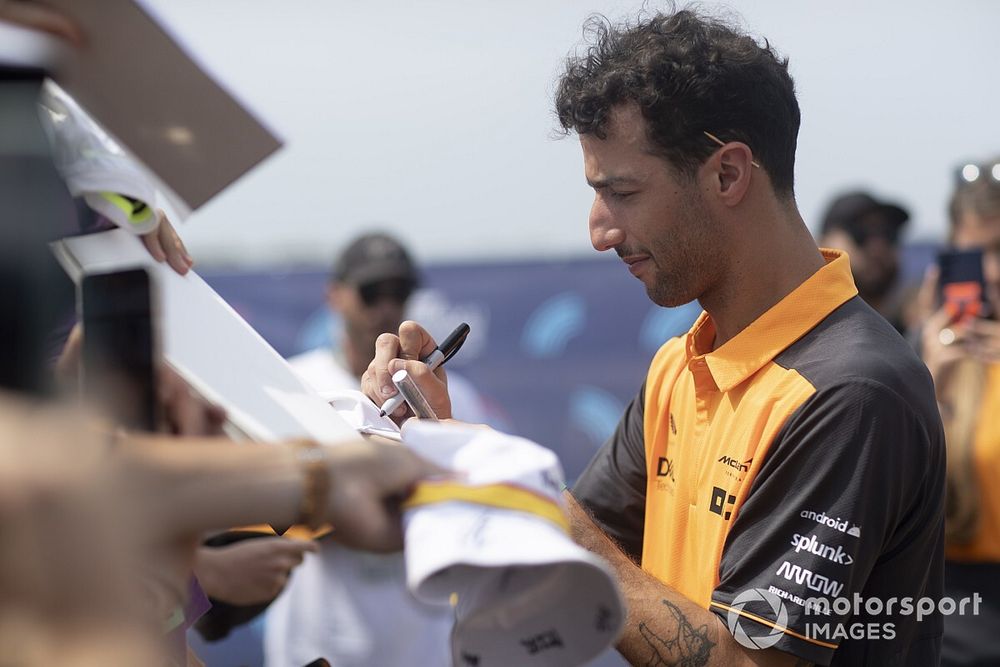 Daniel Ricciardo, McLaren, signs autographs for fans