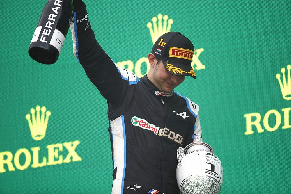 Esteban Ocon, Alpine F1, 1st position, on the podium with his trophy and Champagne