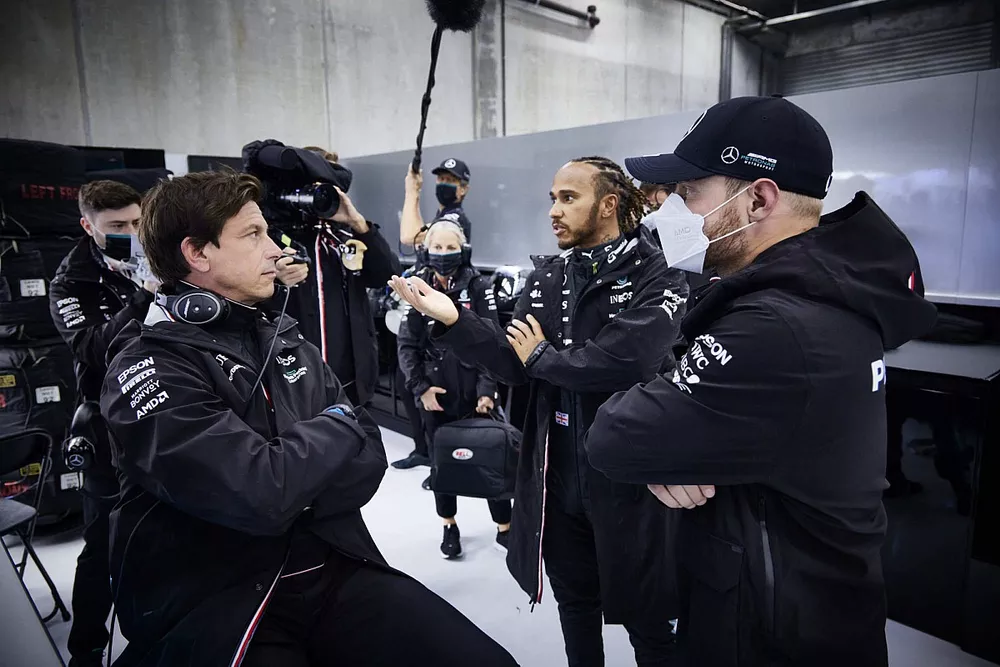 Toto Wolff, Team Principal and CEO, Mercedes AMG, Lewis Hamilton, Mercedes, and Valtteri Bottas, Mercedes, talk in the garage