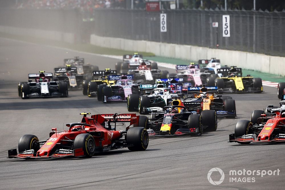 Charles Leclerc, Ferrari SF90, leads Sebastian Vettel, Ferrari SF90, Lewis Hamilton, Mercedes AMG F1 W10, Max Verstappen, Red Bull Racing RB15, Carlos Sainz Jr., McLaren MCL34, and the rest of the field at the start