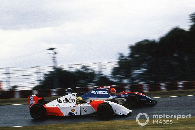 Ayrton Senna, McLaren Ford MP4/8 passes Eddie Irvine, Jordan Hart J193