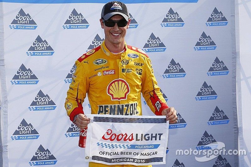 Logano takes Michigan pole, Harvick bit by cautions