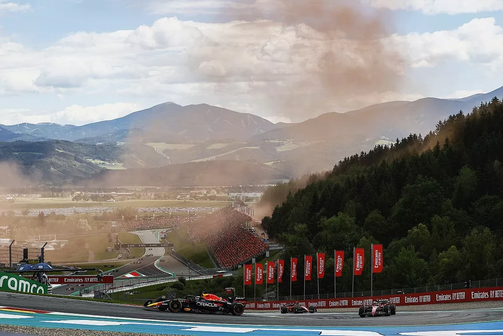 Max Verstappen, Red Bull Racing RB18, leads Charles Leclerc, Ferrari F1-75, and Carlos Sainz, Ferrari F1-75
