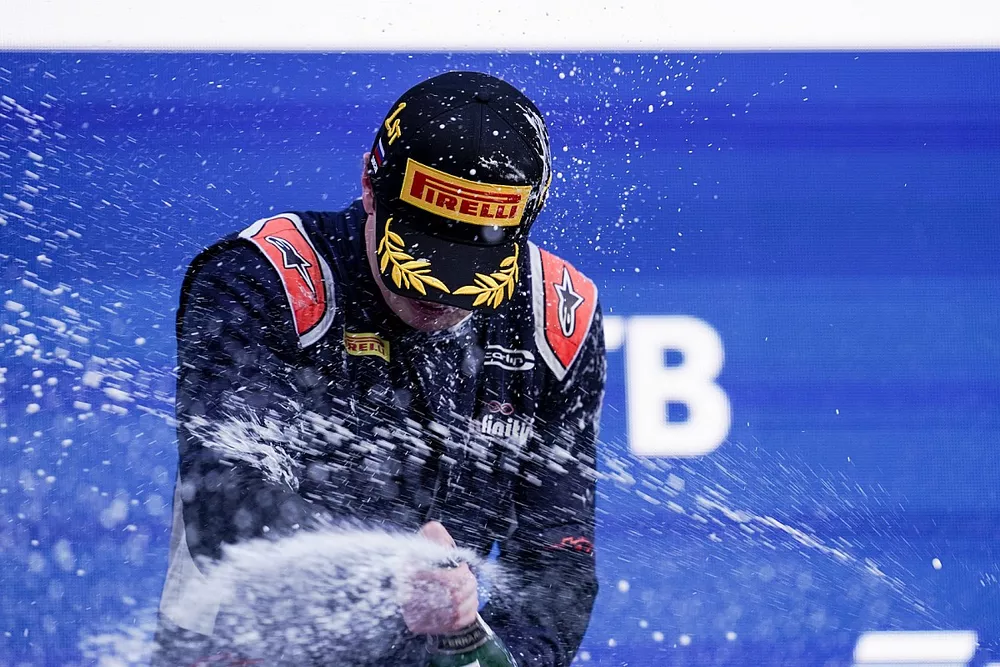 Dan Ticktum, Carlin, 1st position, celebrates with Champagne on the podium