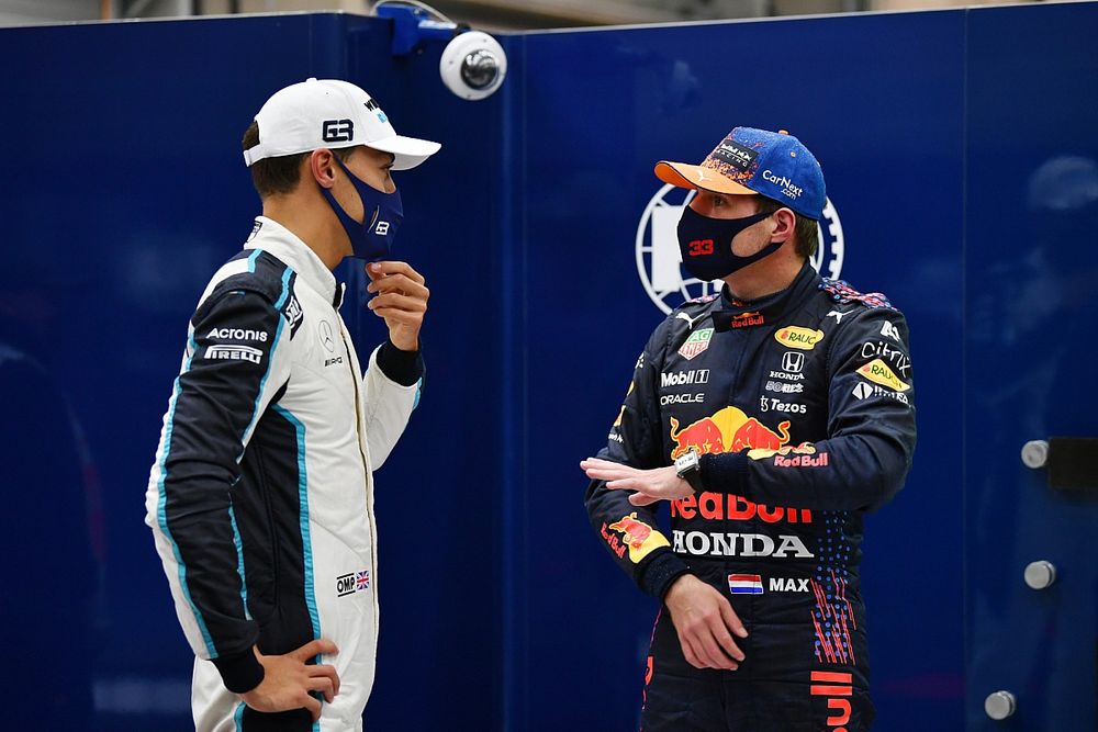 Front row starters George Russell, Williams, and pole man Max Verstappen, Red Bull Racing, talk in Parc Ferme