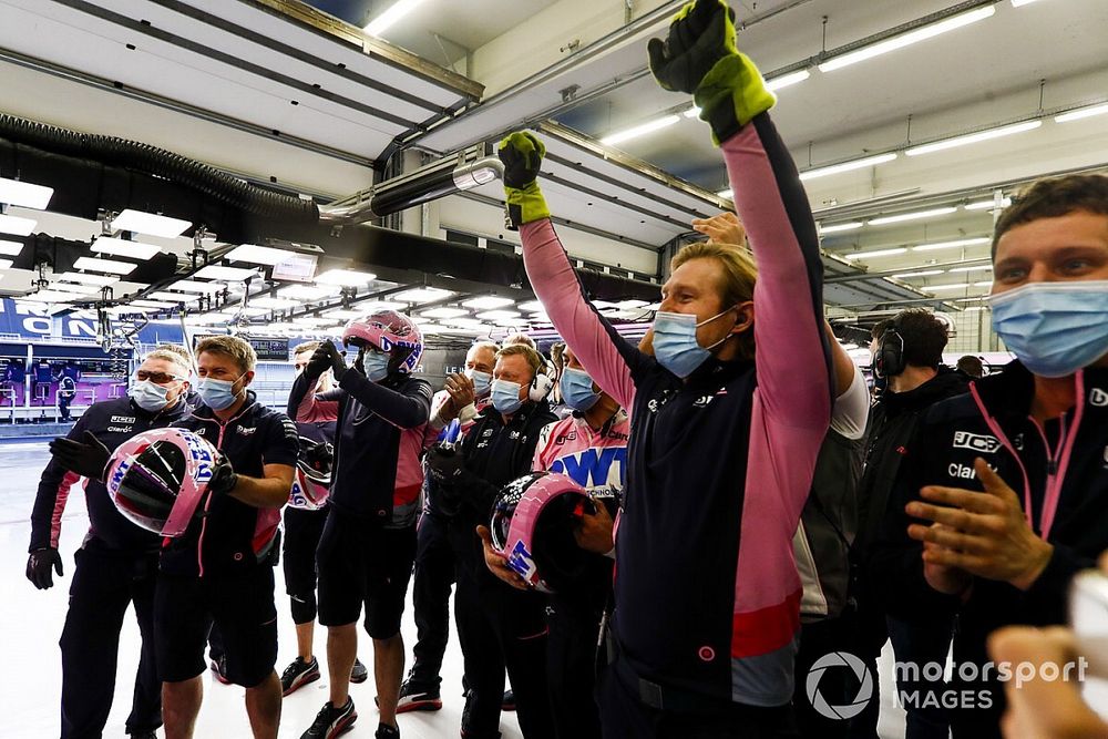 The Racing Point team celebrate in the garage after securing pole with Lance Stroll, Racing Point