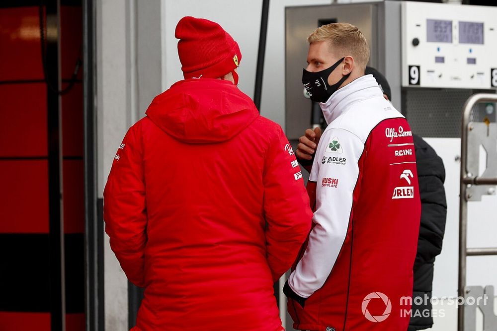 Mick Schumacher, Alfa Romeo Racing, talks with Sebastian Vettel, Ferrari