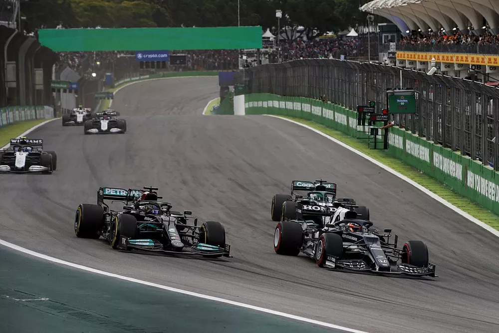 Yuki Tsunoda, AlphaTauri AT02, Lewis Hamilton, Mercedes W12, and Lance Stroll, Aston Martin AMR21