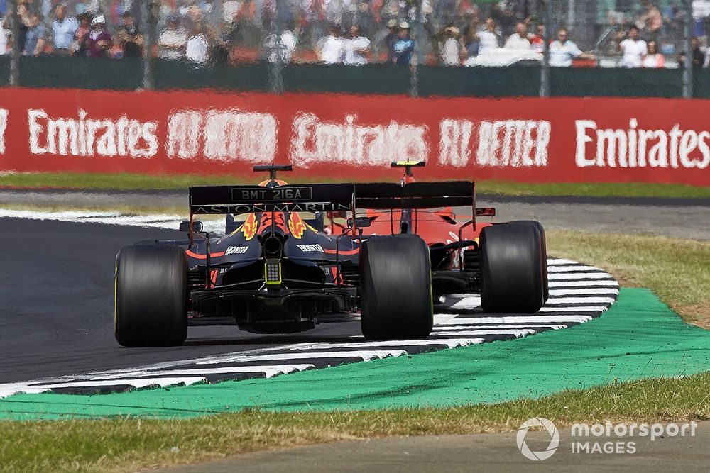 Charles Leclerc, Ferrari SF90, leads Max Verstappen, Red Bull Racing RB15