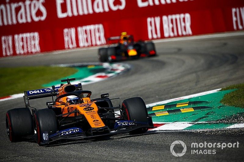 Carlos Sainz Jr., McLaren MCL34, leads Alex Albon, Red Bull Racing RB15