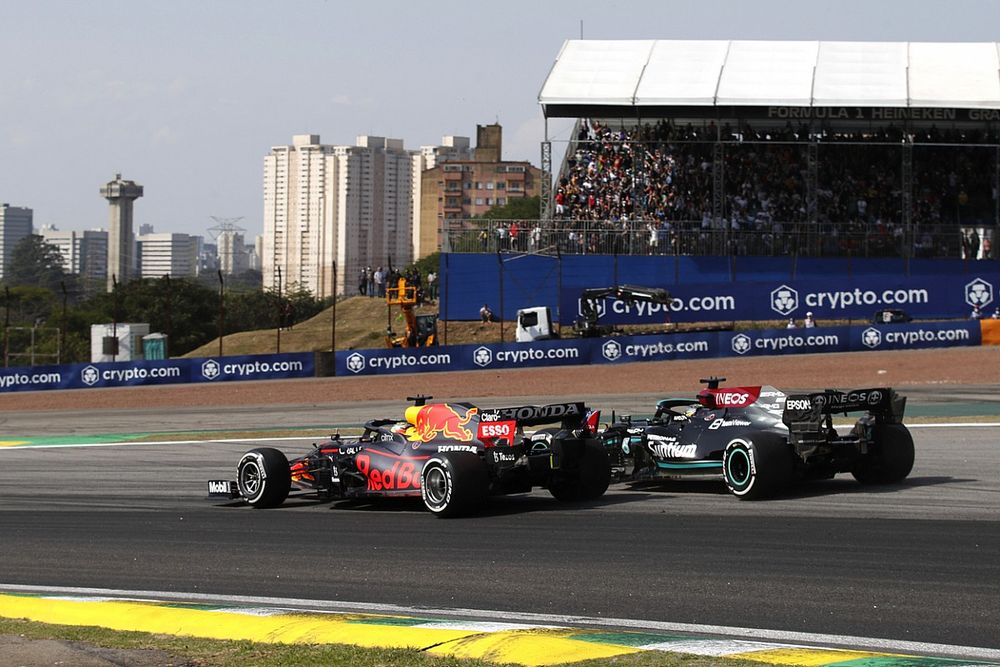 Max Verstappen, Red Bull Racing RB16B, battles with Lewis Hamilton, Mercedes W12