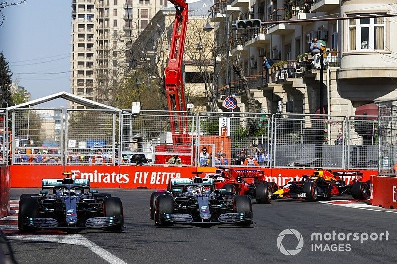 Valtteri Bottas, Mercedes AMG W10 and Lewis Hamilton, Mercedes AMG F1 W10 battle on lap1 