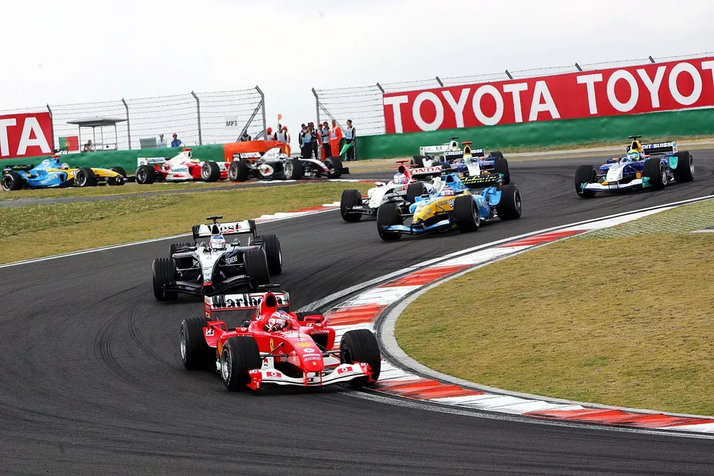 Rubens Barrichello (BRA) Ferrari F2004 leads at the start of the race.