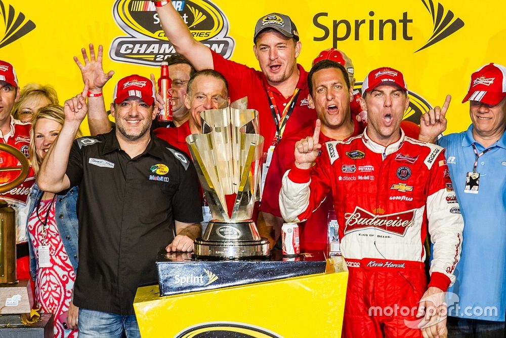 Race winner and 2014 NASCAR Sprint Cup series champion Kevin Harvick, Stewart-Haas Racing Chevrolet celebrates with Tony Stewart and Gene Haas