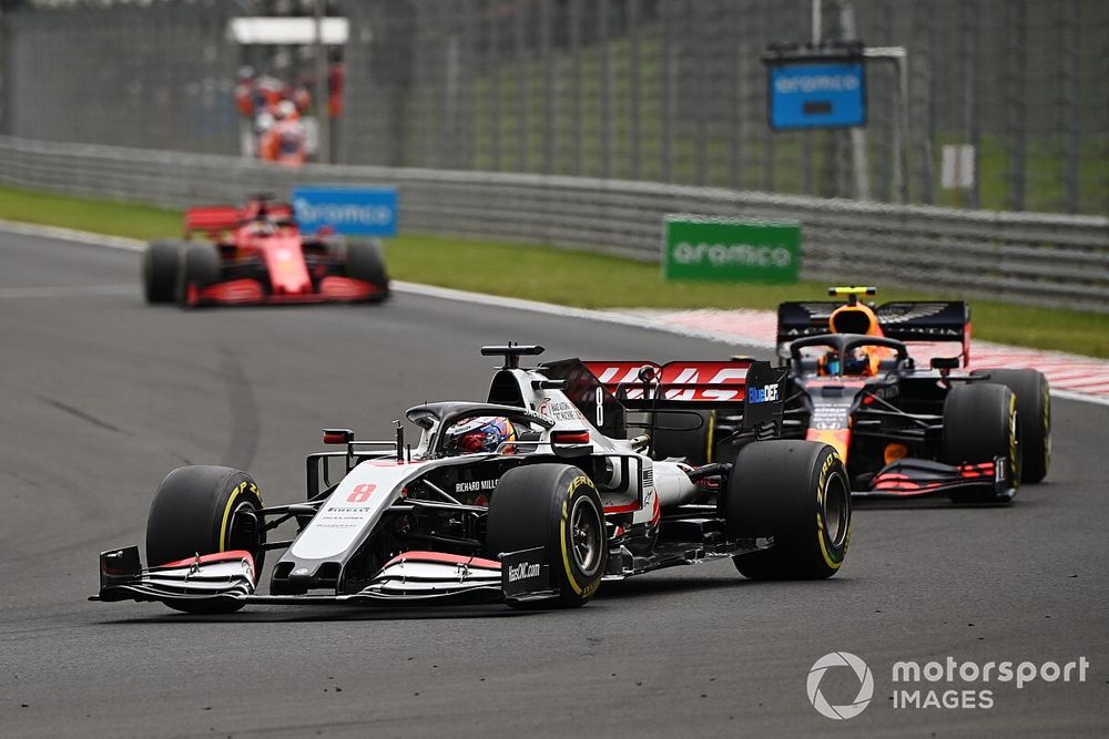 Romain Grosjean, Haas VF-20, leads Alex Albon, Red Bull Racing RB16, and Sebastian Vettel, Ferrari SF1000