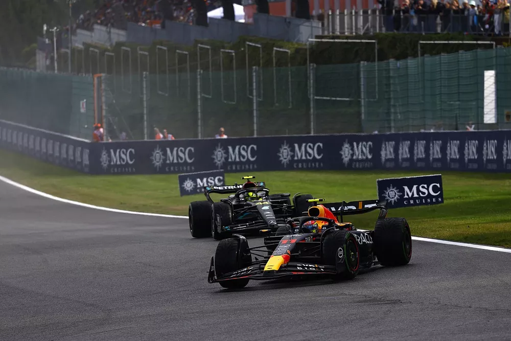 Sergio Perez, Red Bull Racing RB19, leads Lewis Hamilton, Mercedes F1 W14