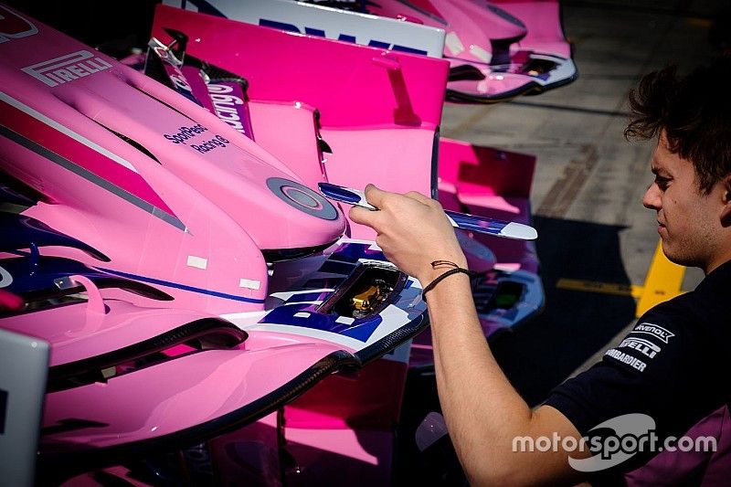 Racing Point team member at work on the front wing