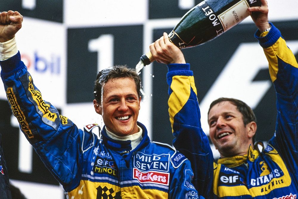 Michael Schumacher, 1st position, and Martin Brundle, 3rd position, celebrate on the podium