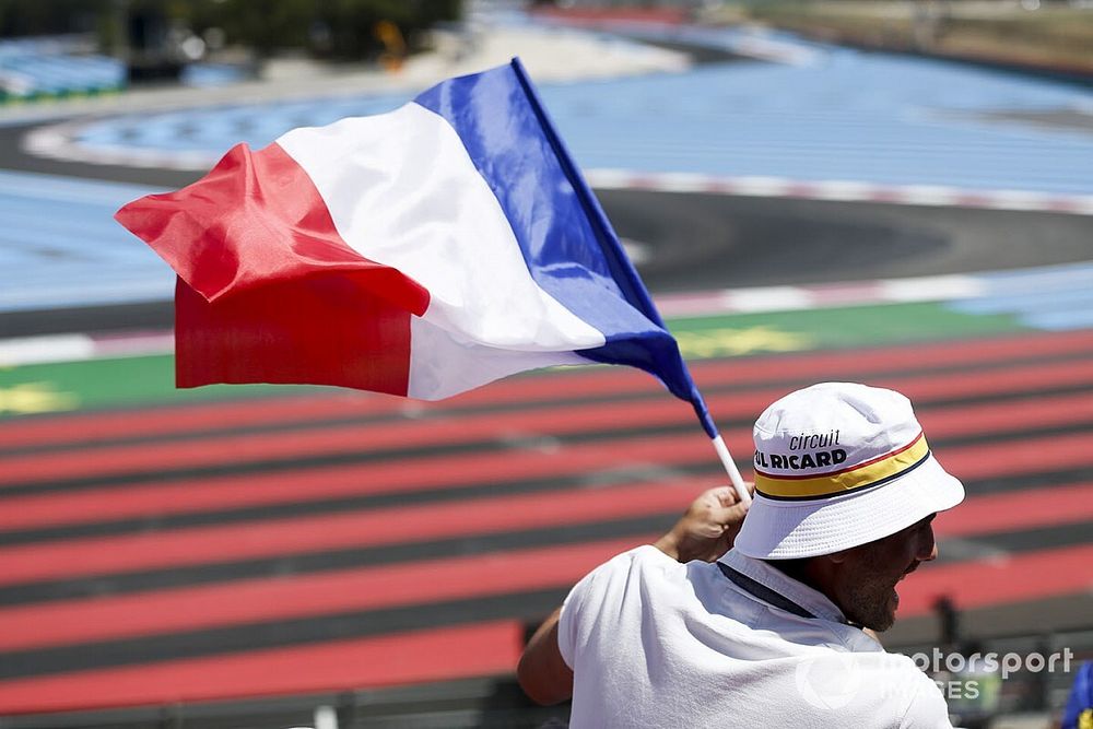 A fan waves the French flag