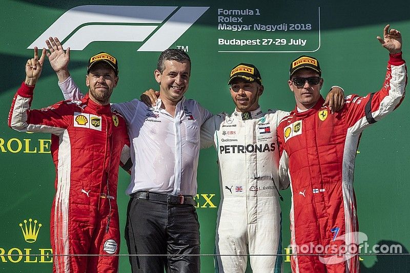 Sebastian Vettel, Ferrari, Lewis Hamilton, Mercedes-AMG F1 and Kimi Raikkonen, Ferrari celebrate on the podium