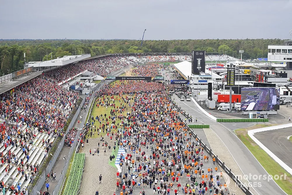 Fans invade the circuit in celebration at the end of the race