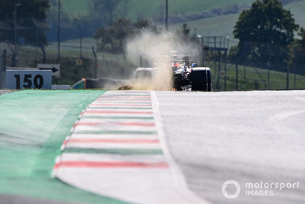 Sparks kick up from the rear of Alex Albon, Red Bull Racing RB16