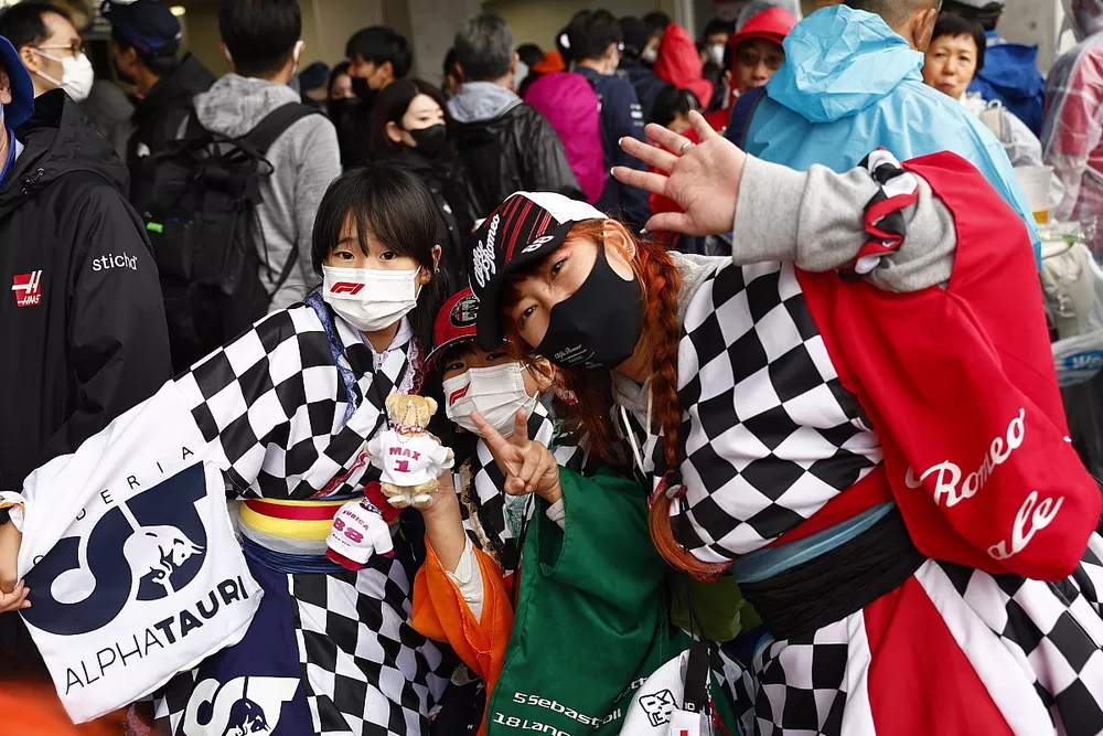 Fans in chequered flag outfits