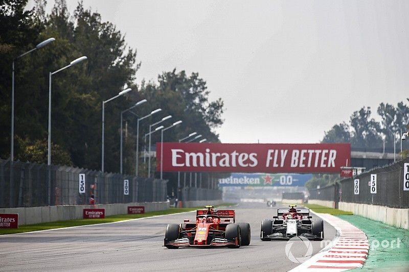 Charles Leclerc, Ferrari SF90, leads Antonio Giovinazzi, Alfa Romeo Racing C38