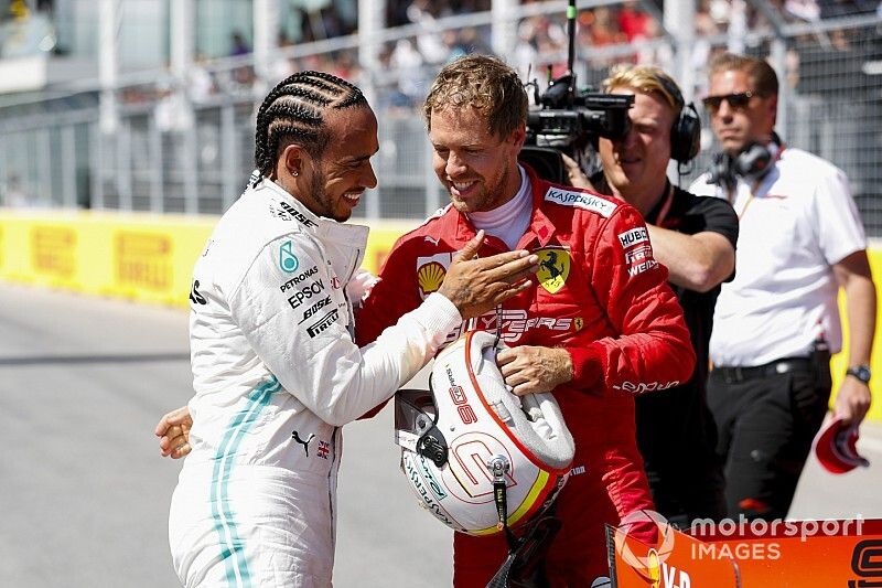 Sebastian Vettel, Ferrari Pole sitter and Lewis Hamilton, Mercedes AMG F1 celebrate in Parc Ferme 