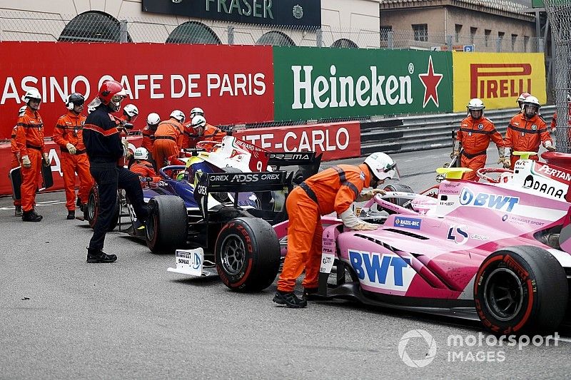 Marshals moving the cars of Mick Schumacher, Prema Racing, Louis Deletraz, Carlin, Anthoine Hubert, Arden after the race is red flagged 
