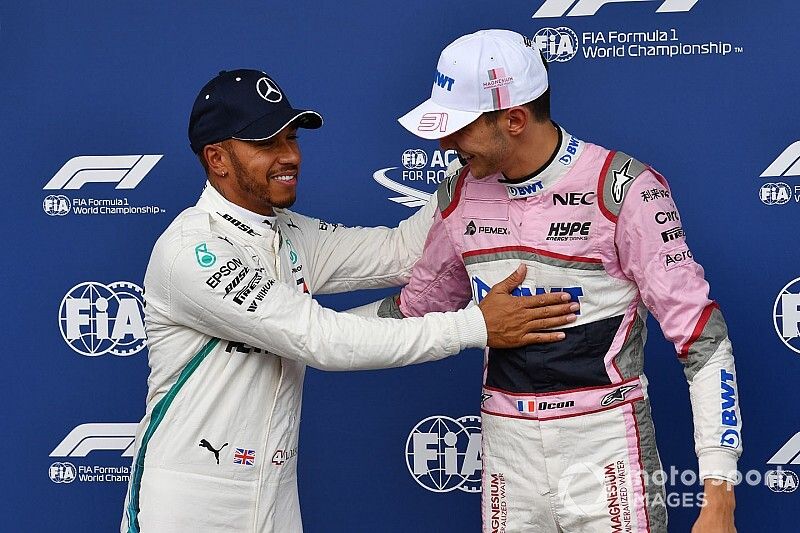 Lewis Hamilton, Mercedes AMG F1 and Esteban Ocon, Racing Point Force India F1 Team celebrate in parc ferme