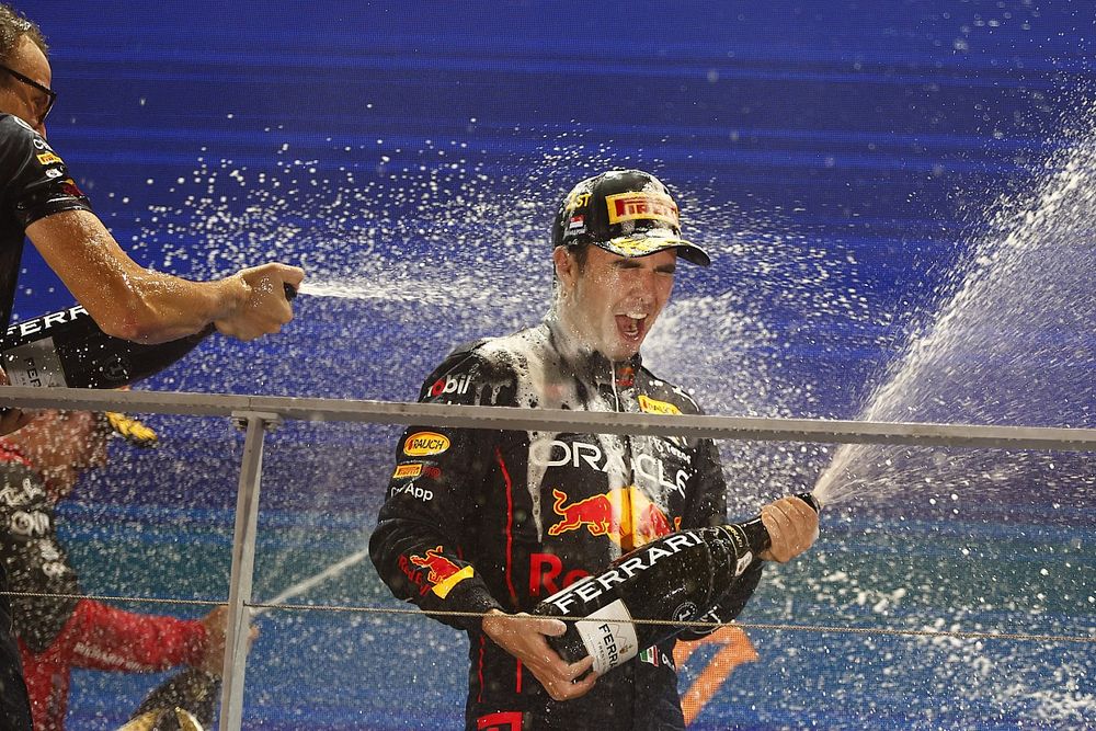 Sergio Perez, Red Bull Racing, 1st position, gets a Champagne soaking on the podium