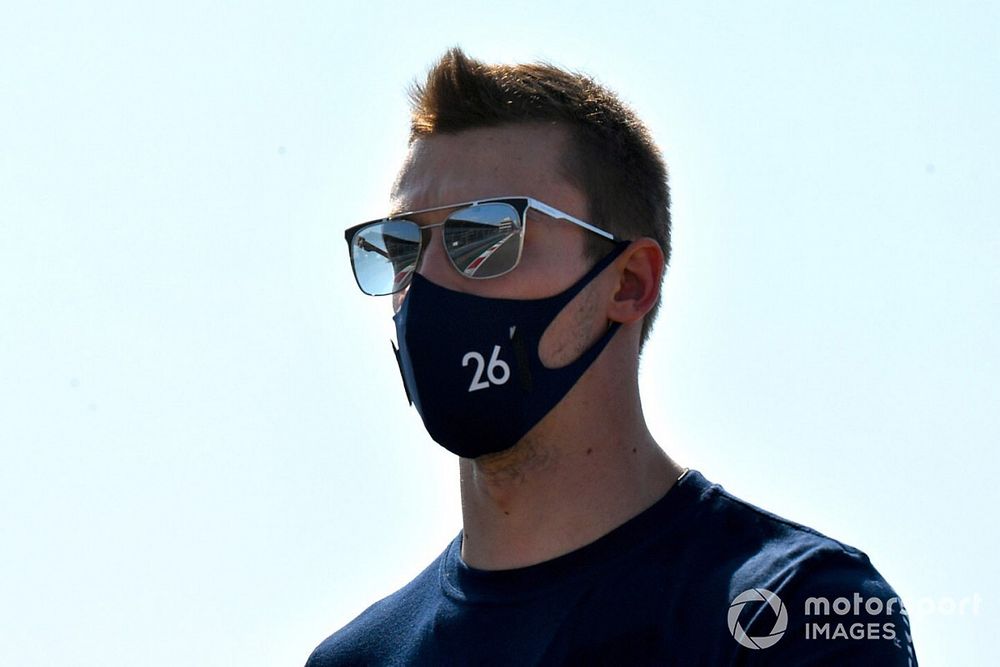 Daniil Kvyat, AlphaTauri, walks the track 