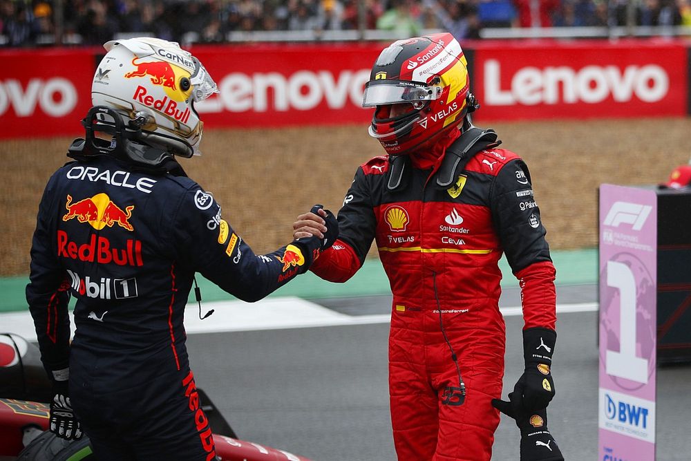 Max Verstappen, Red Bull Racing, congratulates pole man Carlos Sainz, Ferrari, on the grid