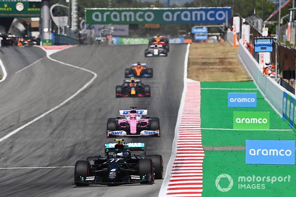 Valtteri Bottas, Mercedes F1 W11 , leads Sergio Perez, Racing Point RP20, and Alex Albon, Red Bull Racing RB16