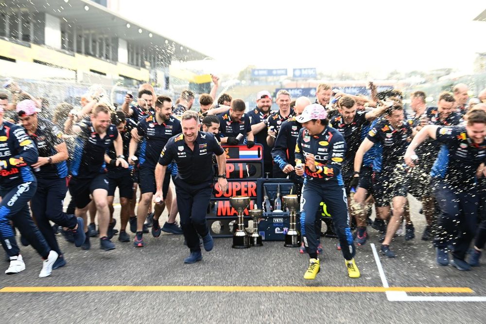 Christian Horner, Team Principal, Red Bull Racing, Sergio Perez, Red Bull Racing, 2nd position, and the Red Bull team celebrate