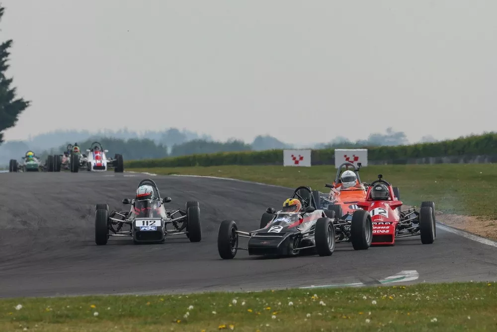 Rick Morris (2) wins the first Classic Formula Ford race ahead of Tom Gadd (112)