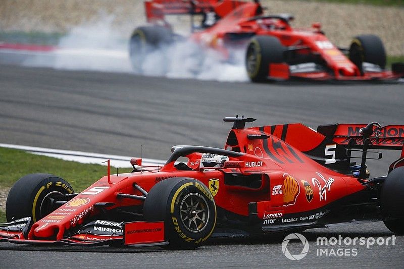 Sebastian Vettel, Ferrari SF90, leads Charles Leclerc, Ferrari SF90, as he locks up