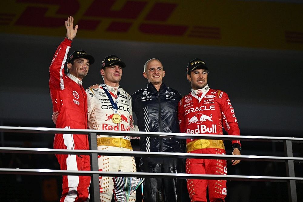 Charles Leclerc, Scuderia Ferrari, 2nd position, Max Verstappen, Red Bull Racing, 1st position, the Red Bull trophy delegate and Sergio Perez, Red Bull Racing, 3rd position, on the podium