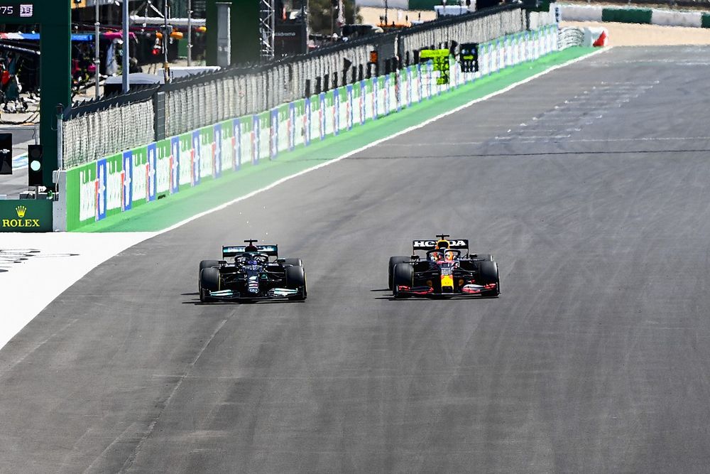 Lewis Hamilton, Mercedes W12, passes Max Verstappen, Red Bull Racing RB16B