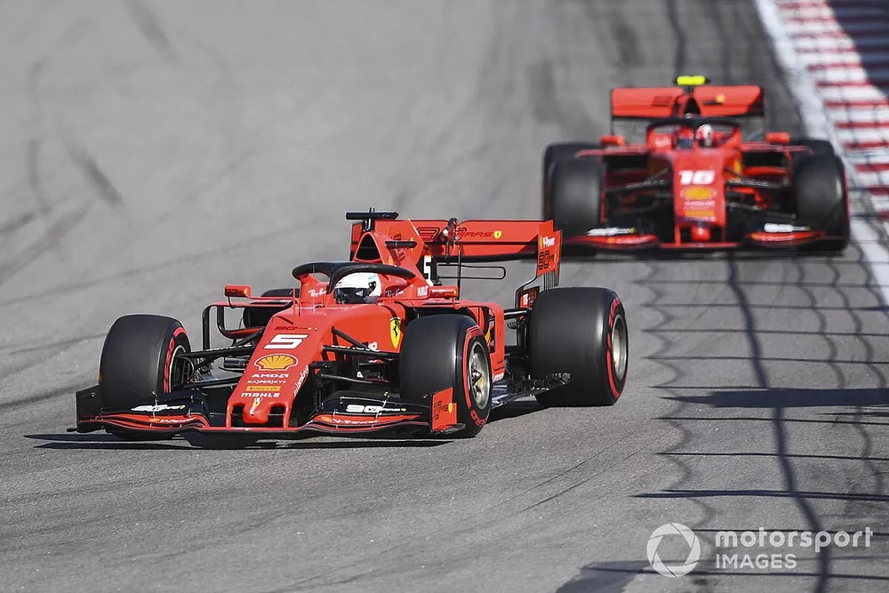 Sebastian Vettel, Ferrari SF90, leads Charles Leclerc, Ferrari SF90